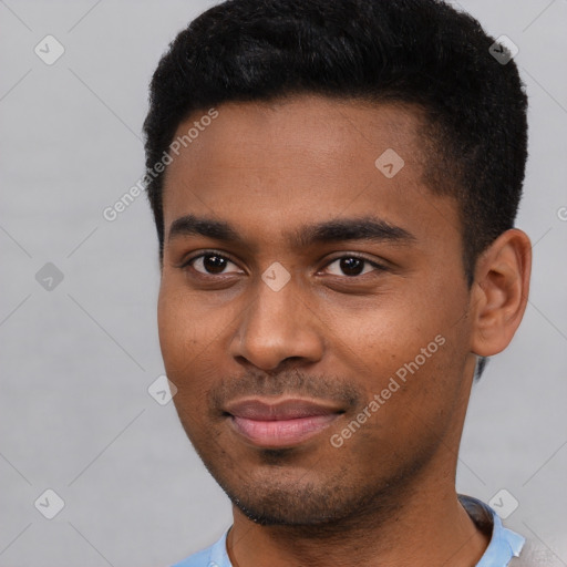 Joyful black young-adult male with short  black hair and brown eyes