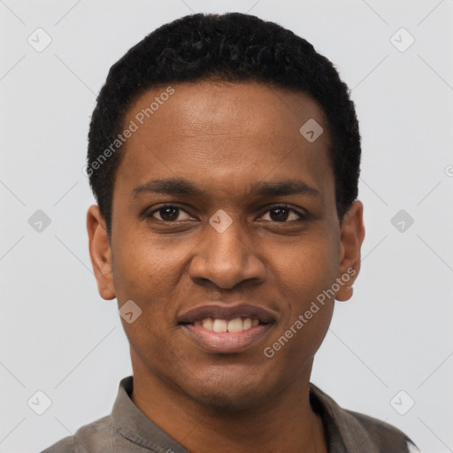 Joyful black young-adult male with short  black hair and brown eyes