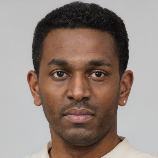 Neutral black young-adult male with short  black hair and brown eyes