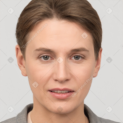 Joyful white young-adult female with short  brown hair and grey eyes