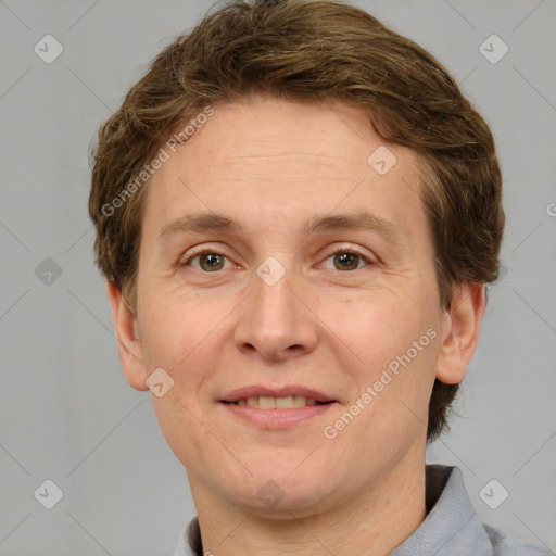 Joyful white adult male with short  brown hair and grey eyes