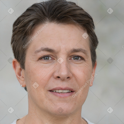 Joyful white adult female with short  brown hair and brown eyes