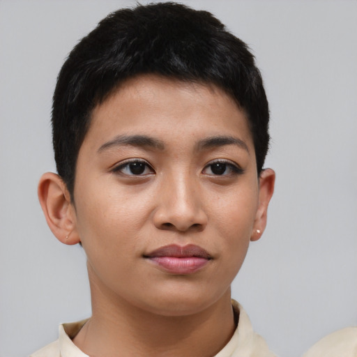 Joyful asian young-adult female with short  black hair and brown eyes