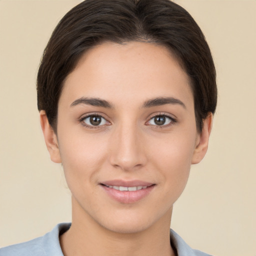 Joyful white young-adult female with short  brown hair and brown eyes