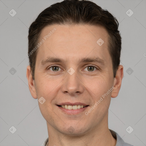 Joyful white adult male with short  brown hair and brown eyes