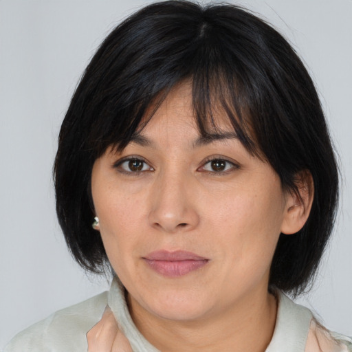 Neutral asian adult female with medium  brown hair and brown eyes