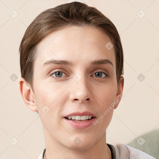 Joyful white young-adult female with short  brown hair and grey eyes