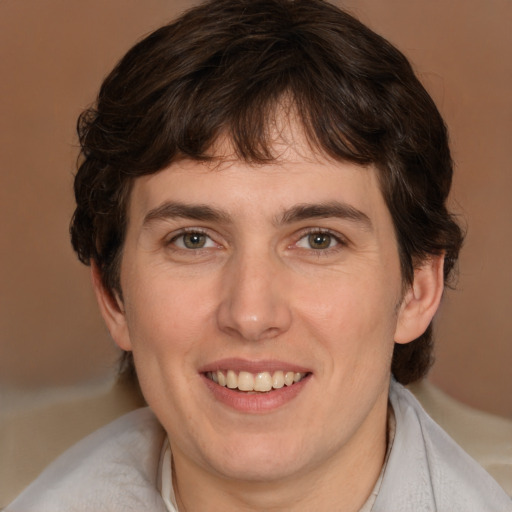 Joyful white young-adult male with medium  brown hair and brown eyes