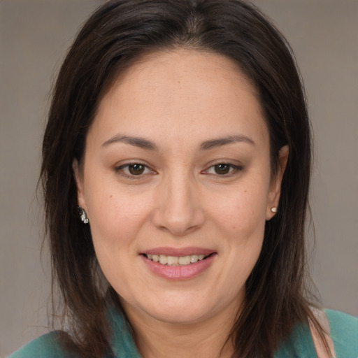 Joyful white adult female with medium  brown hair and brown eyes