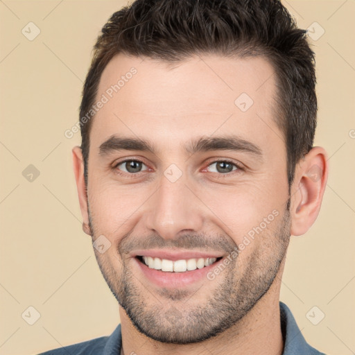 Joyful white young-adult male with short  brown hair and brown eyes