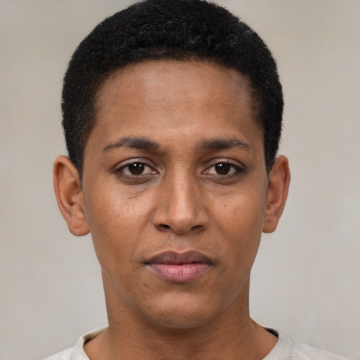 Joyful black young-adult female with short  black hair and brown eyes