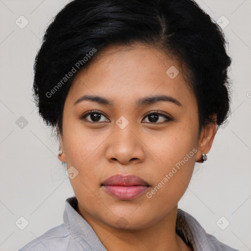 Joyful latino young-adult female with short  black hair and brown eyes