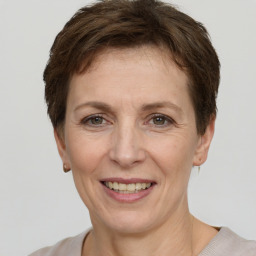 Joyful white adult female with short  brown hair and grey eyes