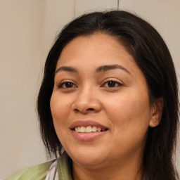 Joyful white adult female with long  brown hair and brown eyes