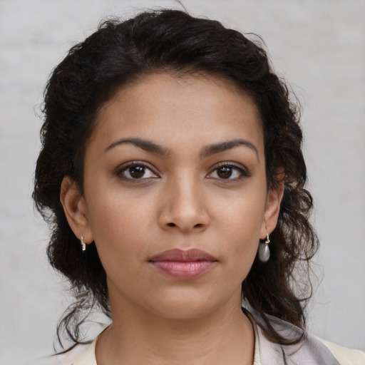 Neutral latino young-adult female with medium  brown hair and brown eyes