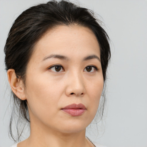 Neutral asian young-adult female with medium  brown hair and brown eyes