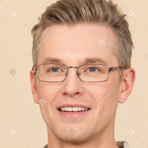 Joyful white adult male with short  brown hair and brown eyes