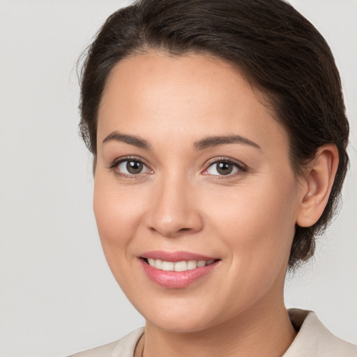 Joyful white young-adult female with medium  brown hair and brown eyes