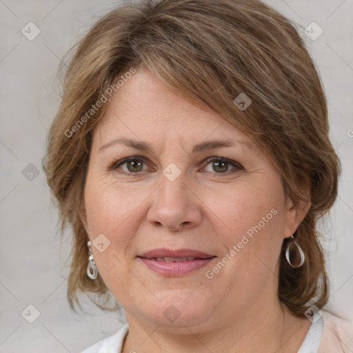 Joyful white adult female with medium  brown hair and brown eyes