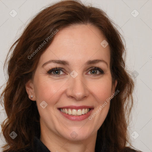 Joyful white adult female with long  brown hair and brown eyes