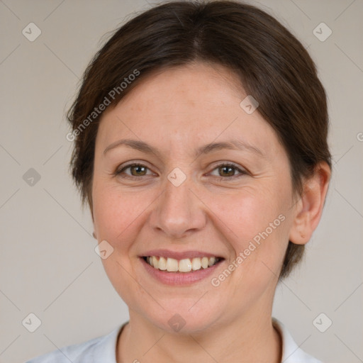 Joyful white adult female with short  brown hair and brown eyes