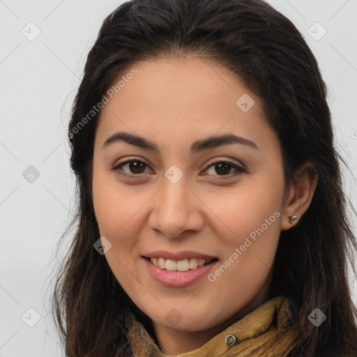 Joyful latino young-adult female with long  brown hair and brown eyes