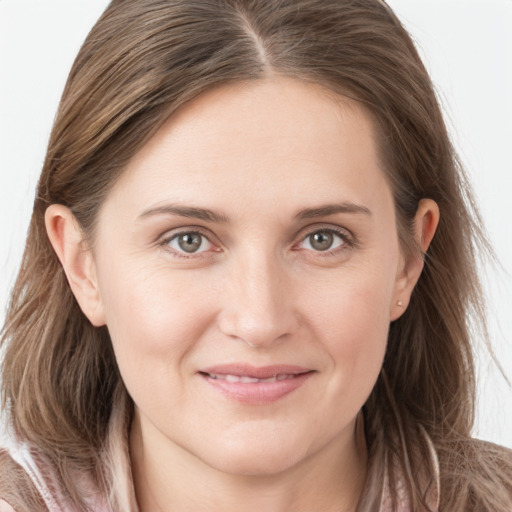 Joyful white young-adult female with long  brown hair and grey eyes