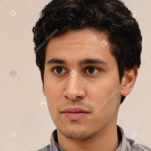 Neutral white young-adult male with short  black hair and brown eyes