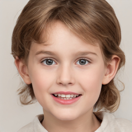 Joyful white child female with medium  brown hair and grey eyes