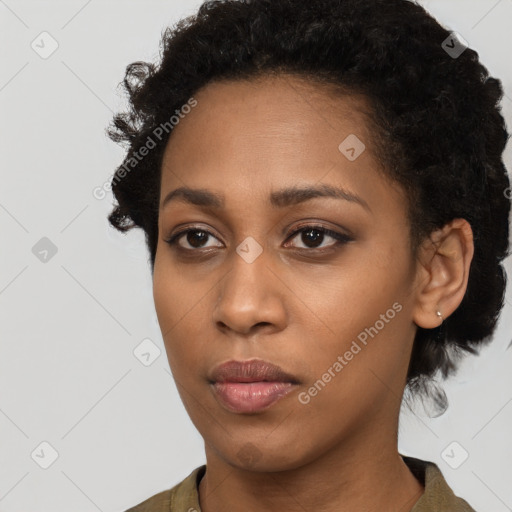 Neutral black young-adult female with short  brown hair and brown eyes