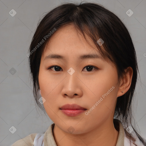 Neutral asian young-adult female with medium  brown hair and brown eyes