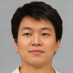 Neutral asian young-adult male with short  brown hair and brown eyes