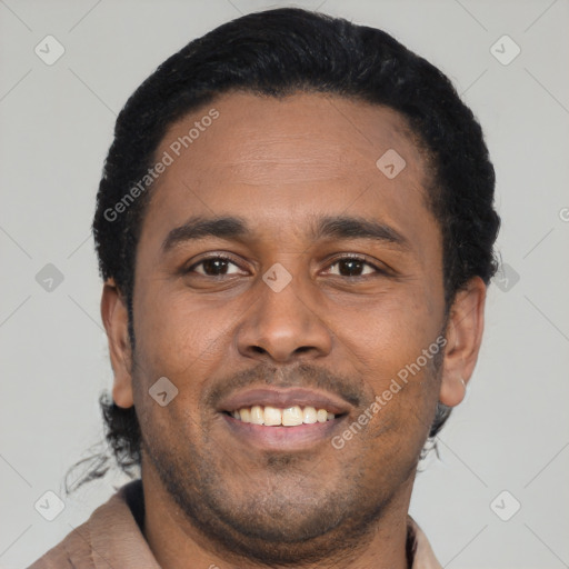 Joyful latino young-adult male with short  black hair and brown eyes