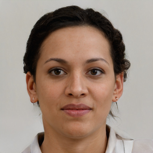 Joyful black young-adult female with medium  brown hair and brown eyes