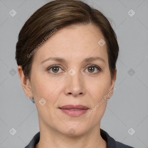 Joyful white adult female with short  brown hair and grey eyes