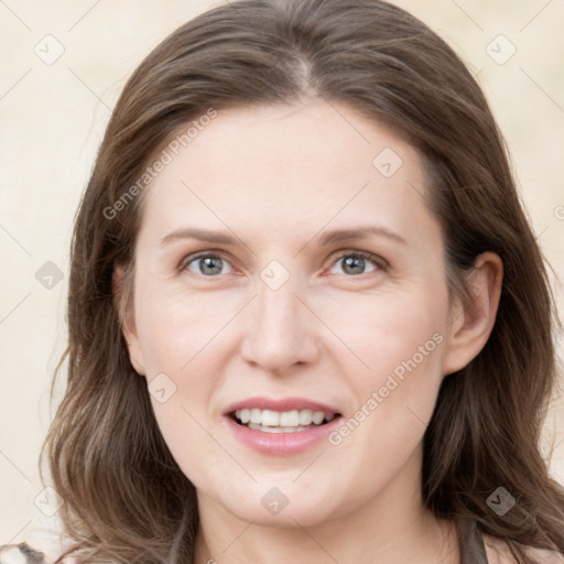 Joyful white young-adult female with long  brown hair and grey eyes