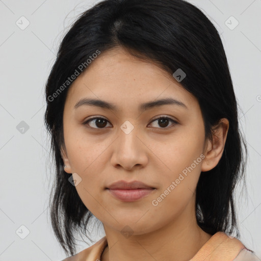 Joyful asian young-adult female with medium  black hair and brown eyes