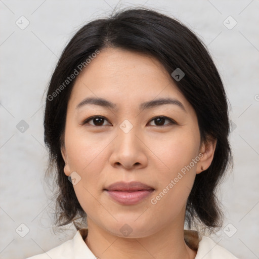 Joyful asian young-adult female with medium  brown hair and brown eyes