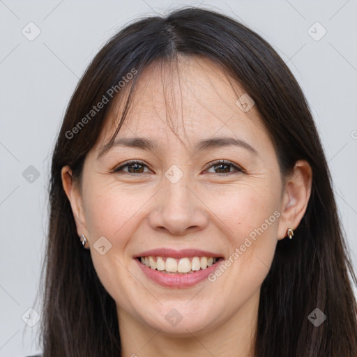 Joyful white adult female with long  brown hair and brown eyes