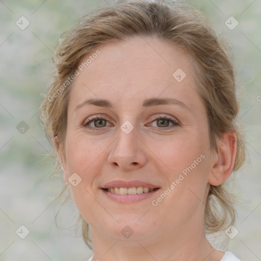 Joyful white young-adult female with medium  brown hair and green eyes