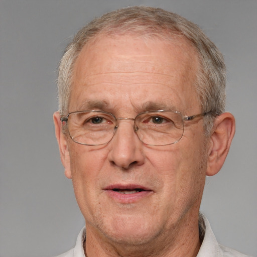 Joyful white middle-aged male with short  gray hair and brown eyes