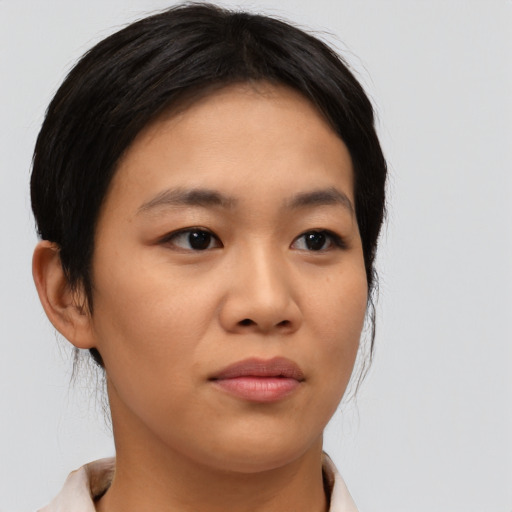 Neutral asian young-adult female with medium  brown hair and brown eyes