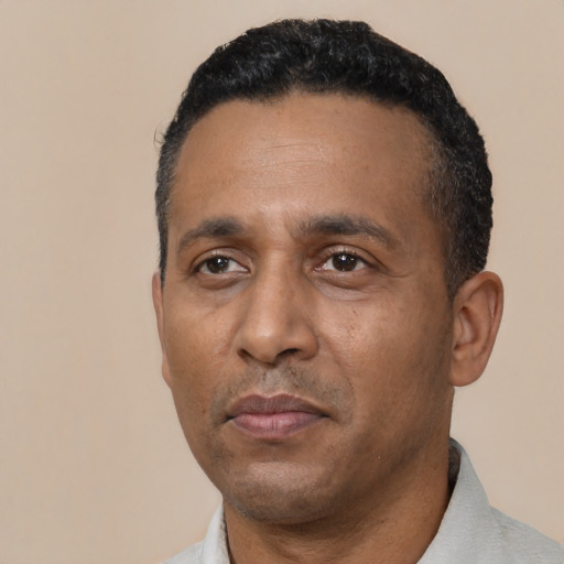 Neutral black adult male with short  black hair and brown eyes