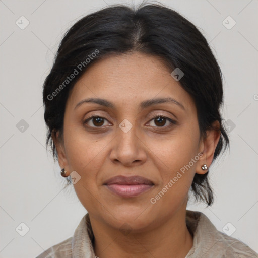 Joyful latino adult female with medium  brown hair and brown eyes