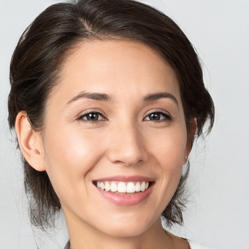 Joyful white young-adult female with medium  brown hair and brown eyes