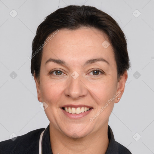 Joyful white adult female with short  brown hair and brown eyes