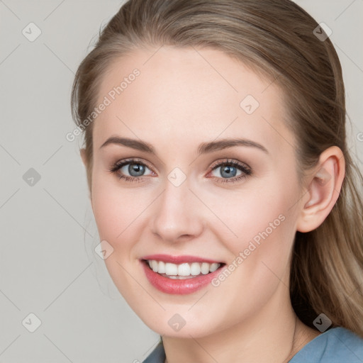 Joyful white young-adult female with long  brown hair and blue eyes