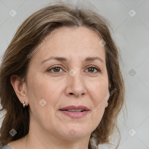 Joyful white adult female with medium  brown hair and grey eyes