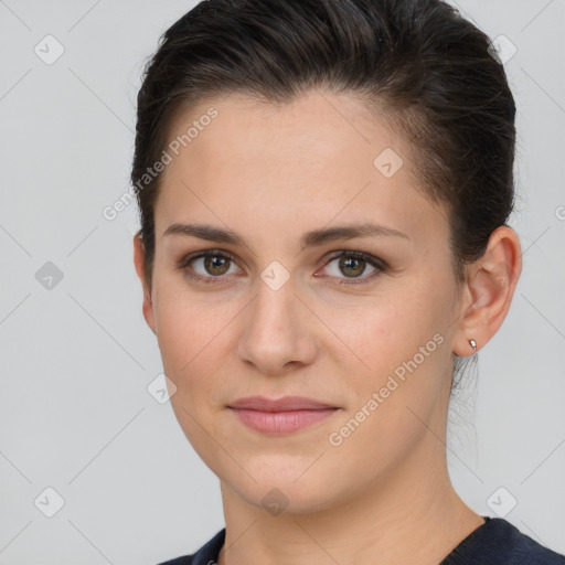 Joyful white young-adult female with short  brown hair and brown eyes