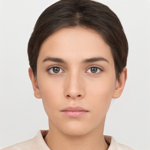 Neutral white young-adult female with short  brown hair and brown eyes